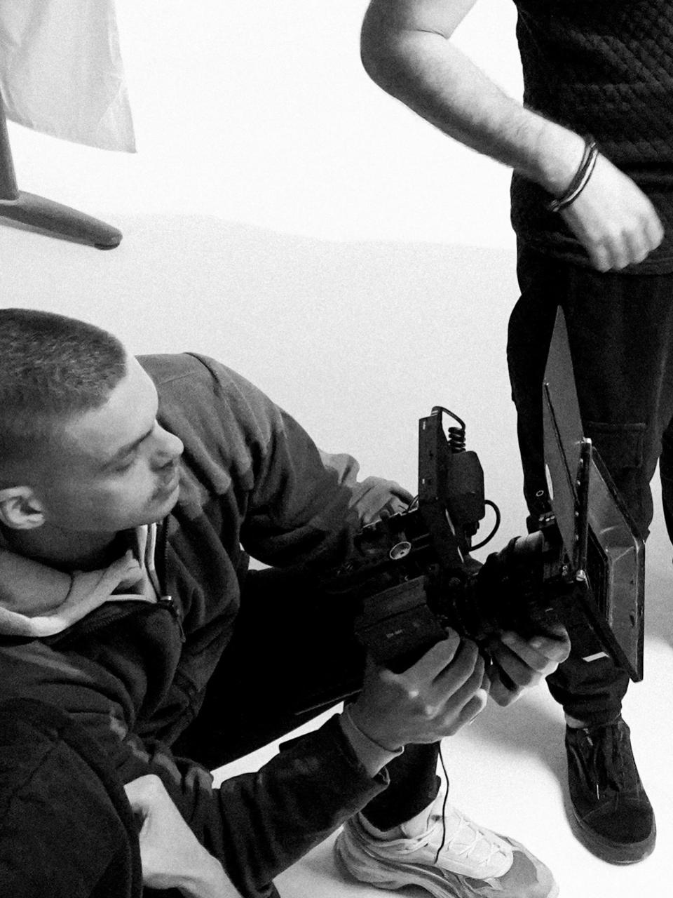 Chris Lianopoulos operating a cinema camera on set